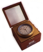 image of a small chronometer in a wooden box